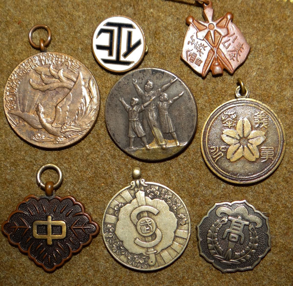 Eight Small Japanese Badges