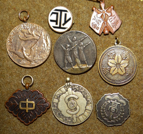 Eight Small Japanese Badges